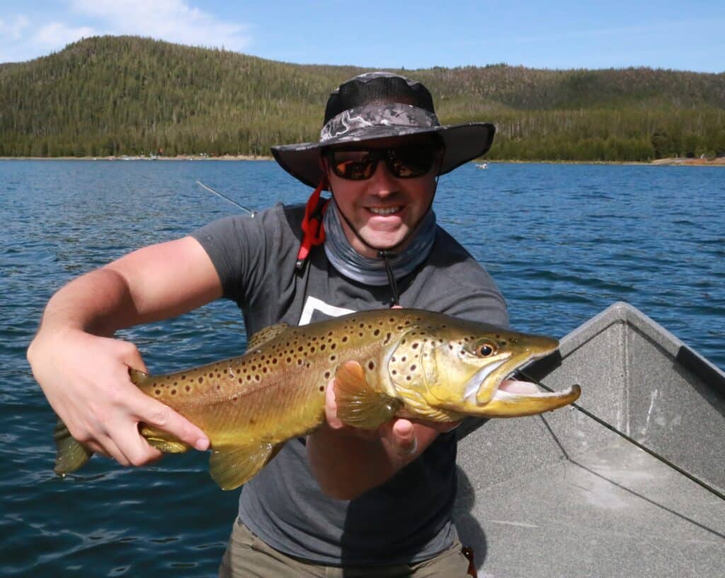 A proud angler displays a big brown trout caught in East Lake.Nestled in a caldera just south of Bend, East Lake is famous for it's record-setting brown and rainbow trout.