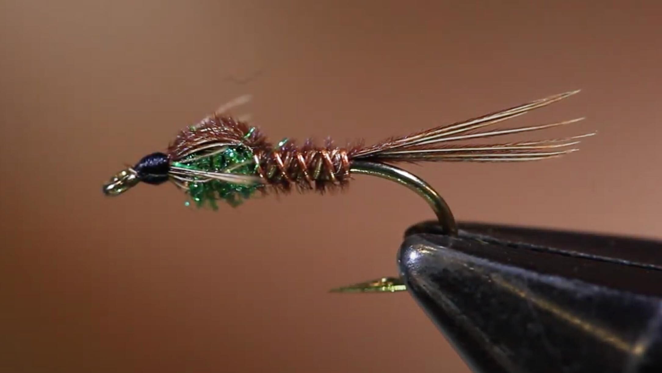 A pheasant tail nymph in the vice