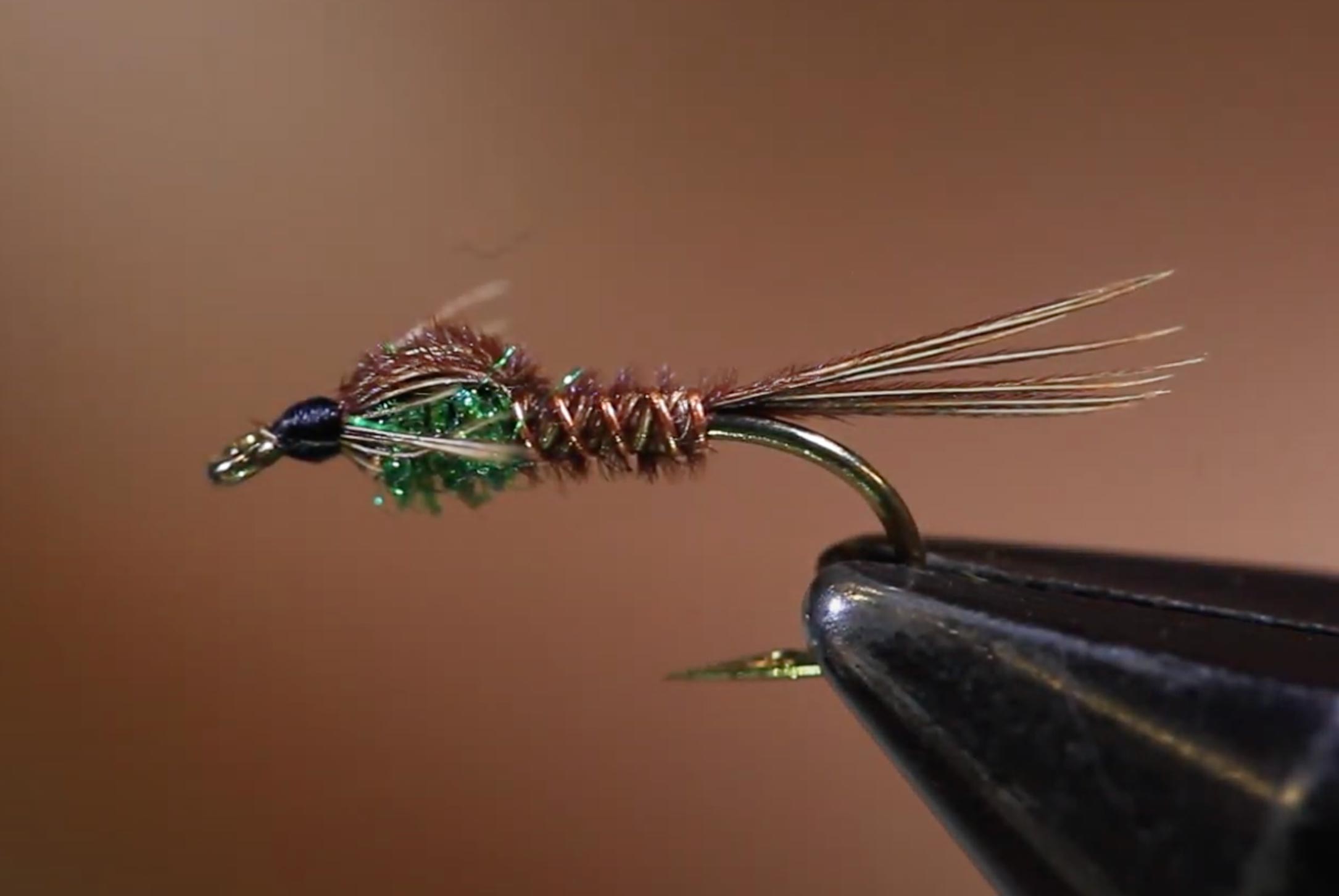 A pheasant tail nymph in the vice