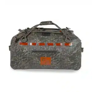 The Fishpond Grande Duffel sitting on the ground