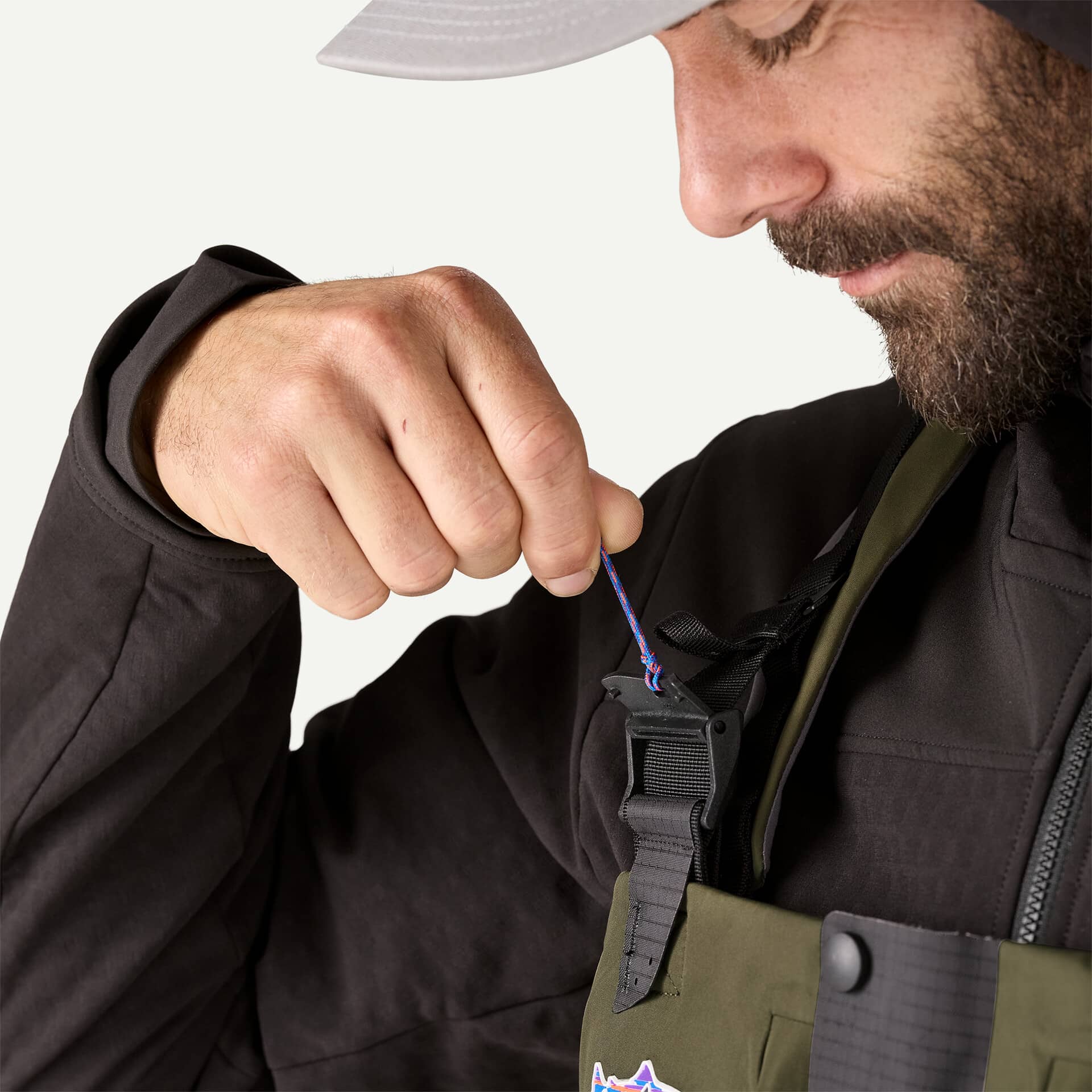 The adjustable strap on the Patagonia Swiftcurrent Expedition Zipfront waders